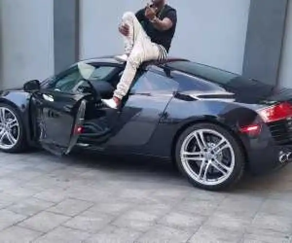 Photo: Davido Balances On Top Of His New R8 Car